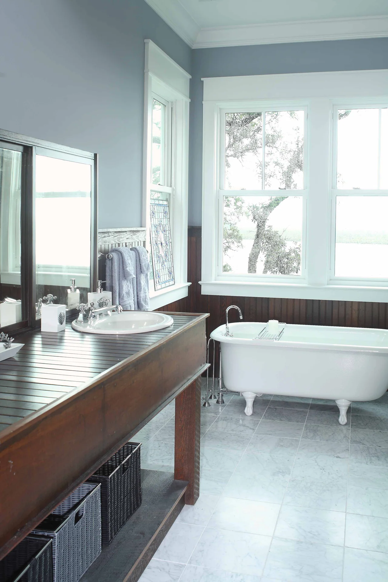Bathroom with a wood vanity and freestanding tub
