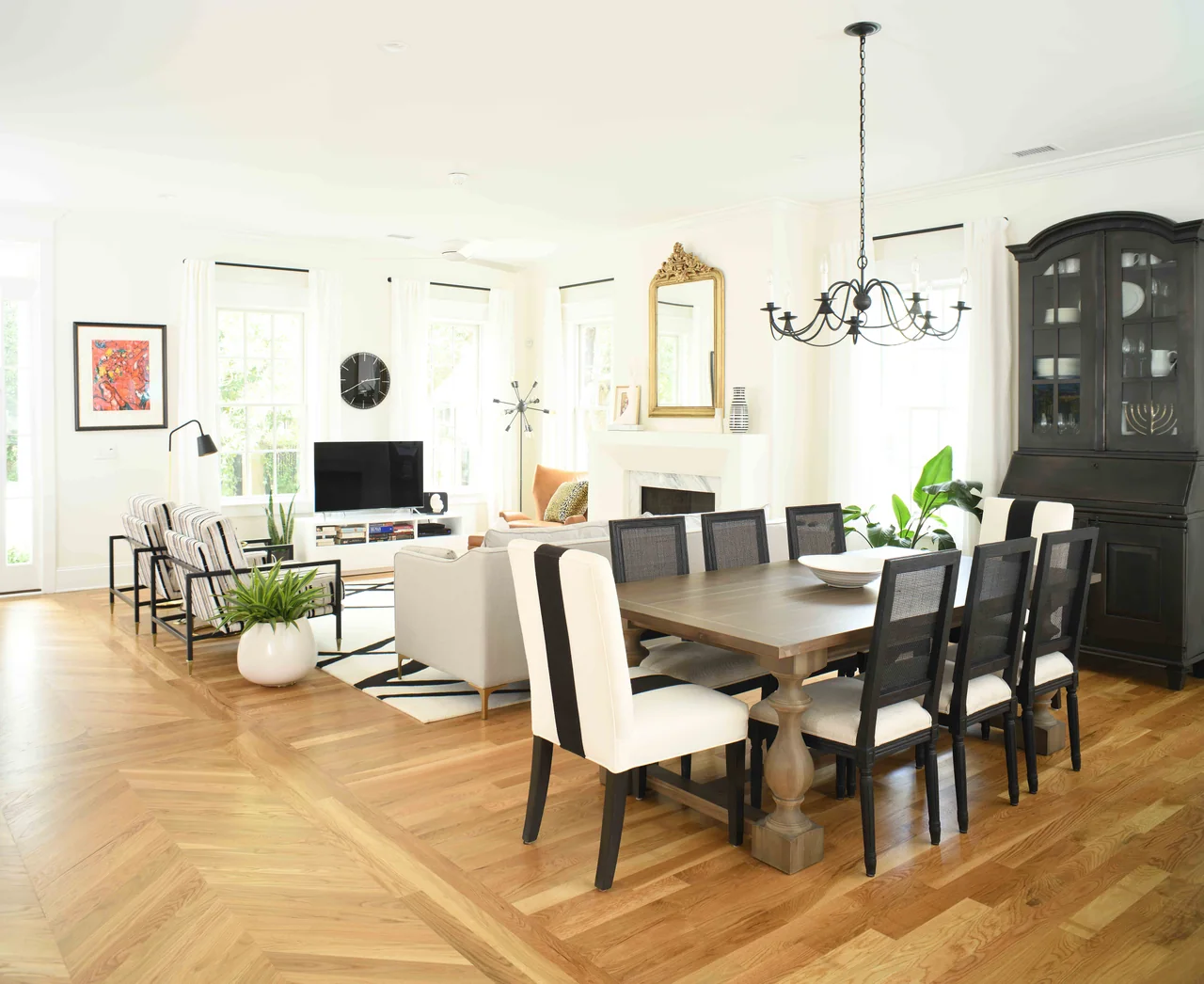 Open dining and living room with black-and-white accents