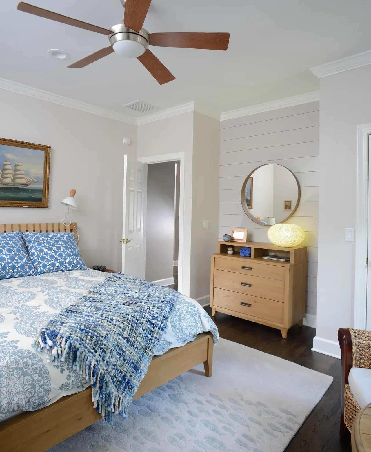 Guest bedroom with blue patterned bedding